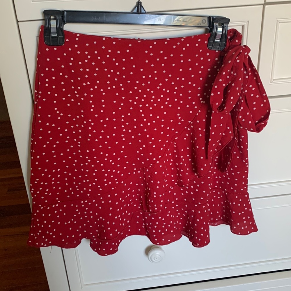 Red and White polka dot, crossover, mini skirt. Womens size small.